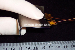 Fully assembled variable emittance skin (“device”)